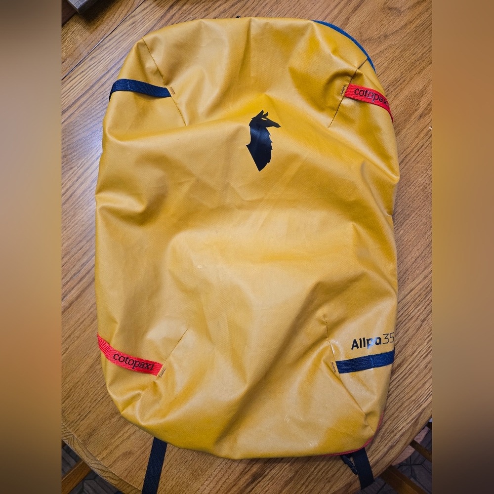 Allpa 35L Travel Pack. Yellow and Multi. Used for one trip.